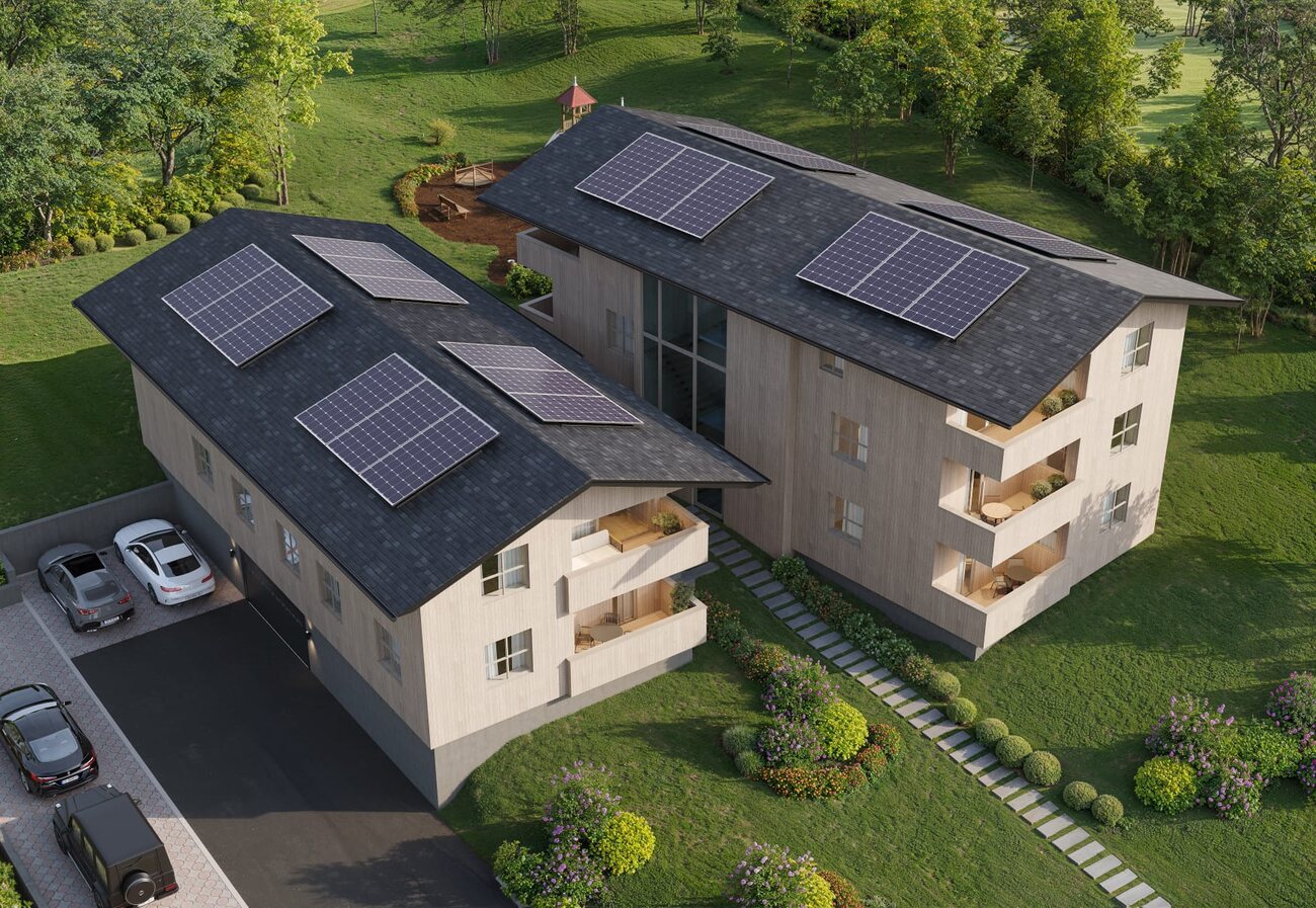 Luftbild-Visualisierung der Sonnenallee Göfis: zwei Baukörper mit Photovoltaik-Dächern